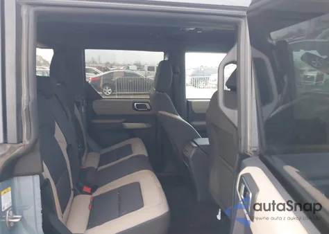 2023 Ford Bronco Wildtrak from USA, damaged, VIN 1FMEE5DPXPLB66865